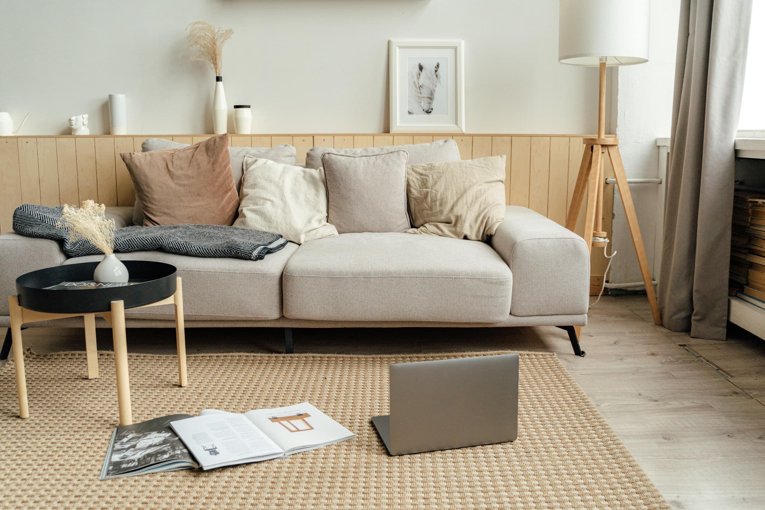 The same empty living room shown twice: the real photo, and the virtually staged version with furniture added digitally.