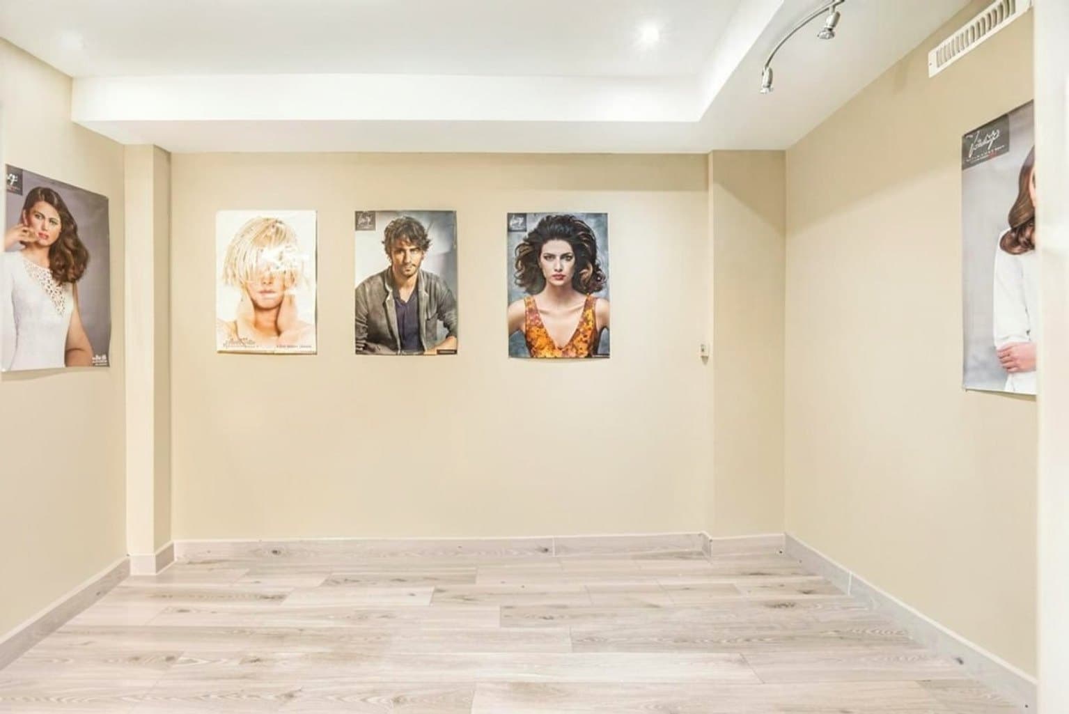 Basement Salon listing photo after AI furniture removal — salon chairs & stations cleared, room untouched