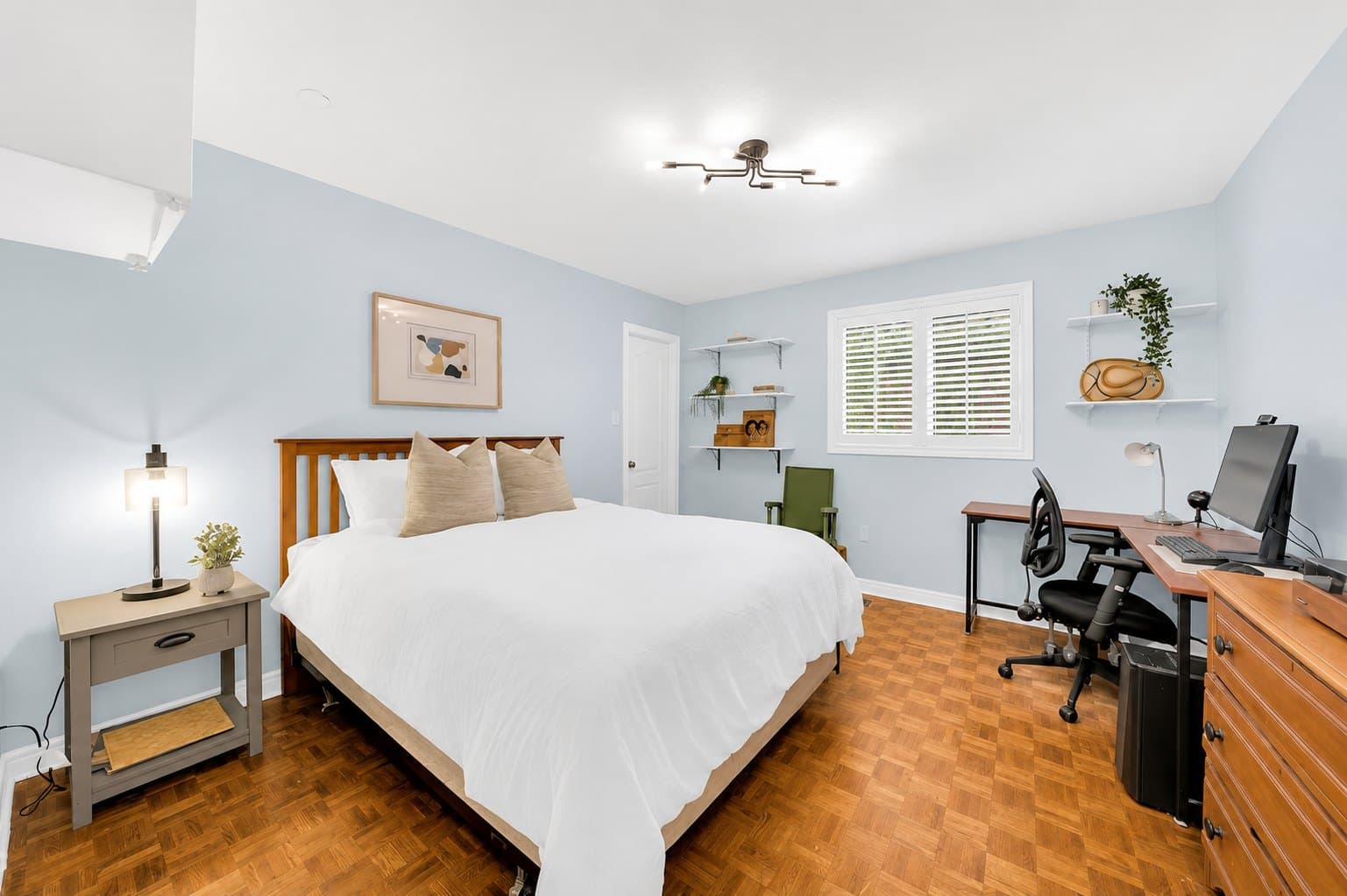 Bedroom listing photo before AI furniture removal — bed, desk & shelving still in the room