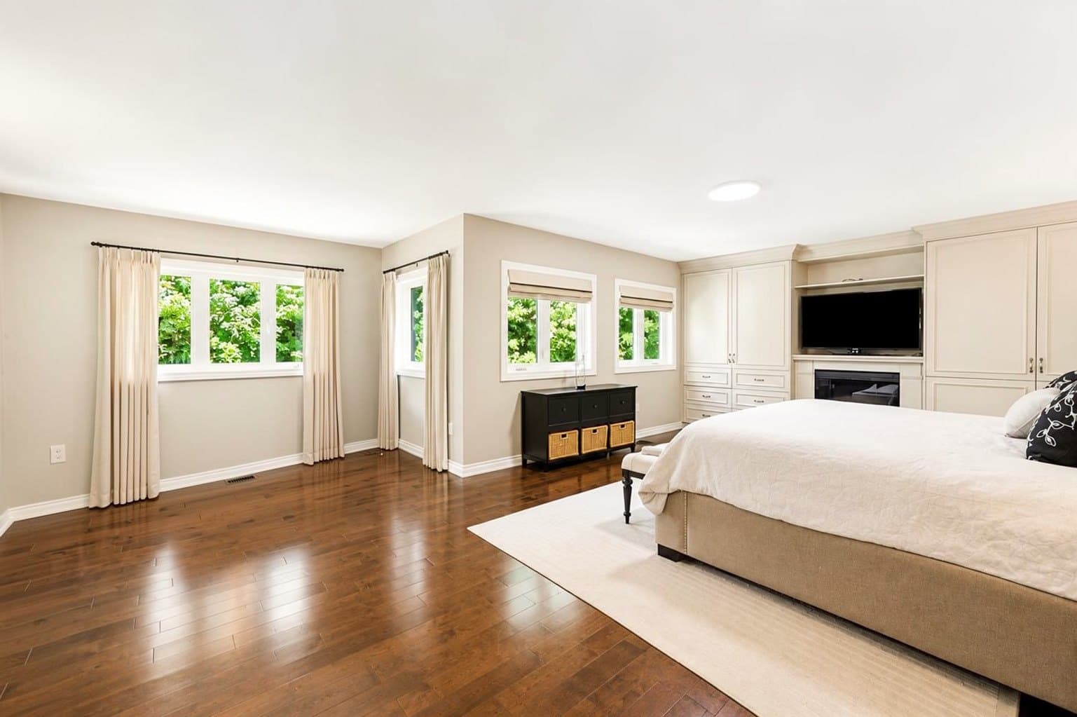 Primary Bedroom listing photo after AI furniture removal — sitting area & dresser cleared, room untouched